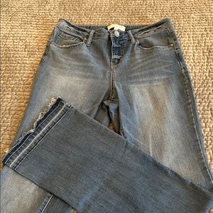 Women's Jeans with distressed hem.